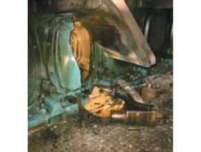 Damaged crankhouse door with broken bearings